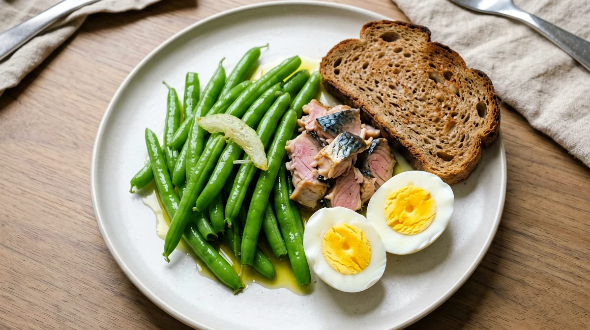 Mackerel, hard-boiled egg and green beans on rye bread